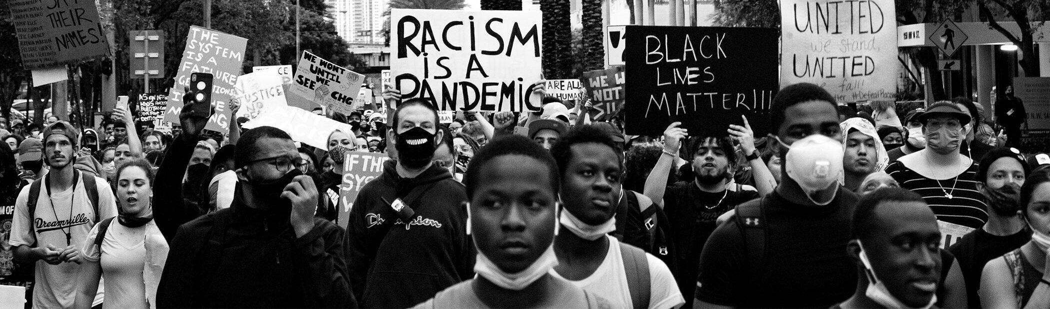 group of protesters holding signs