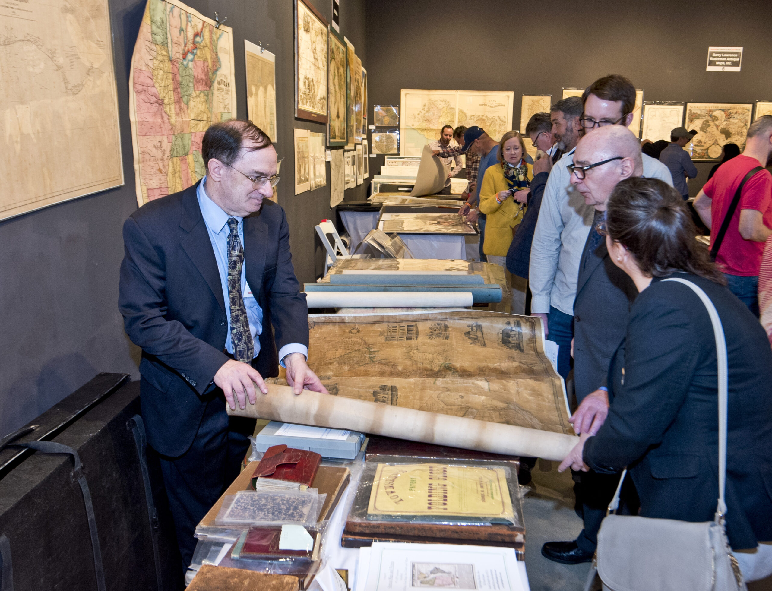 Adults looking at maps on a tables