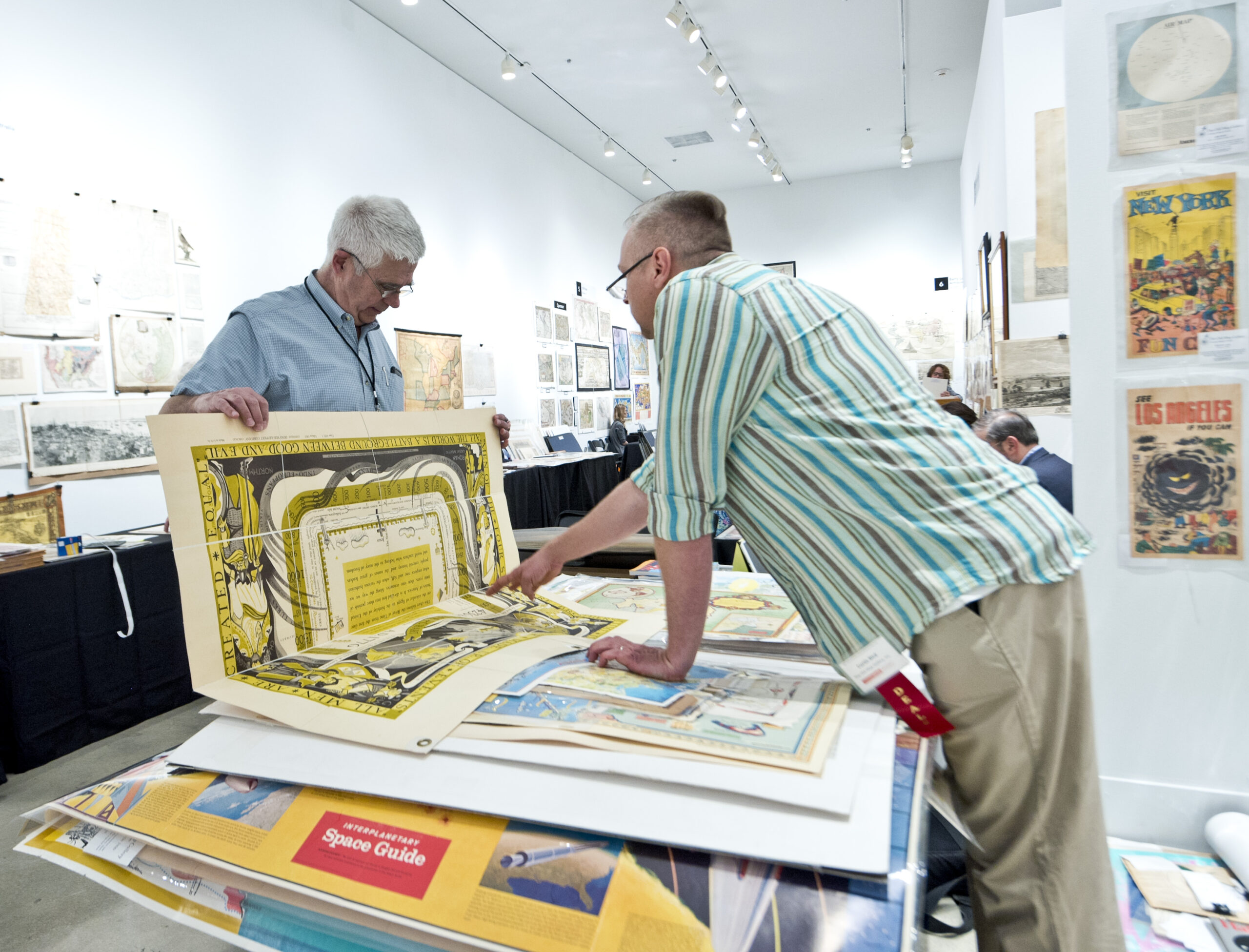 man showing map to another man