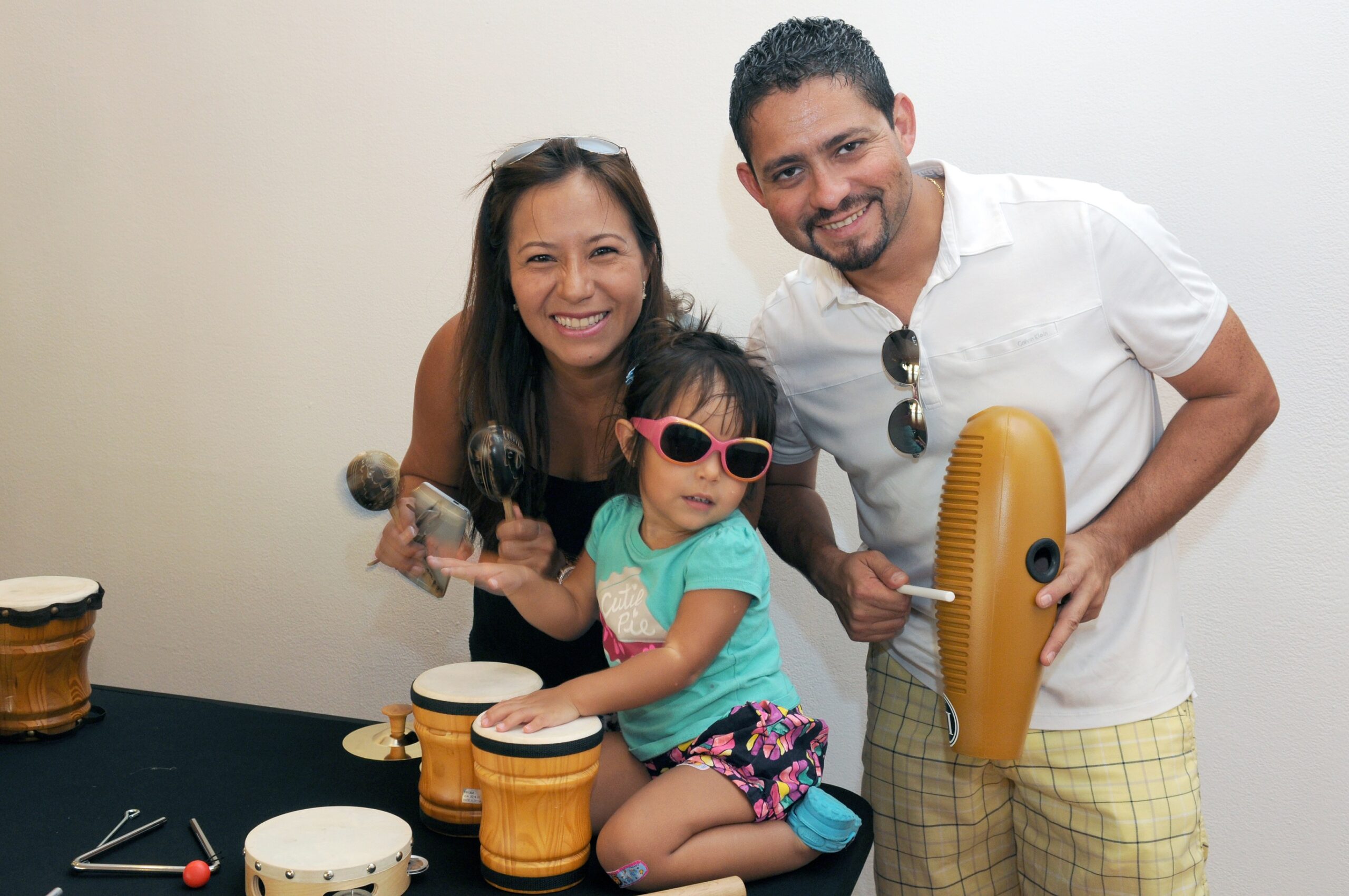 man and woman with child with ,music instruments