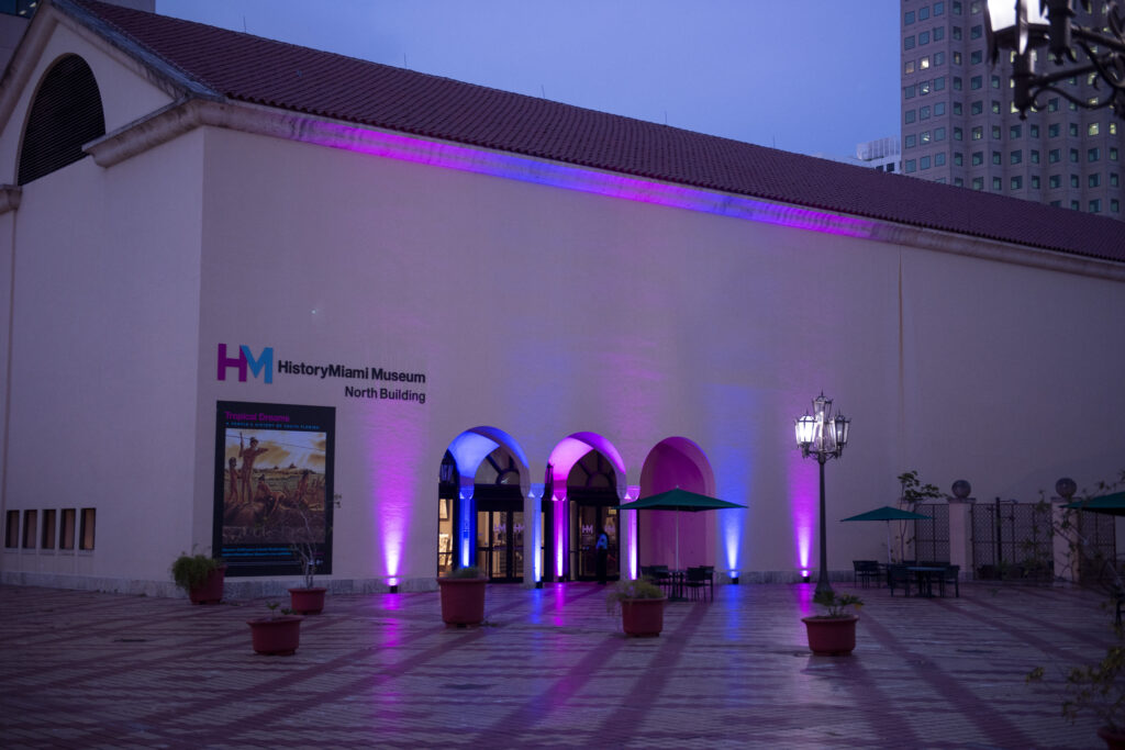 Museum of Miami North building in the evening with up lights highlighting the entrance
