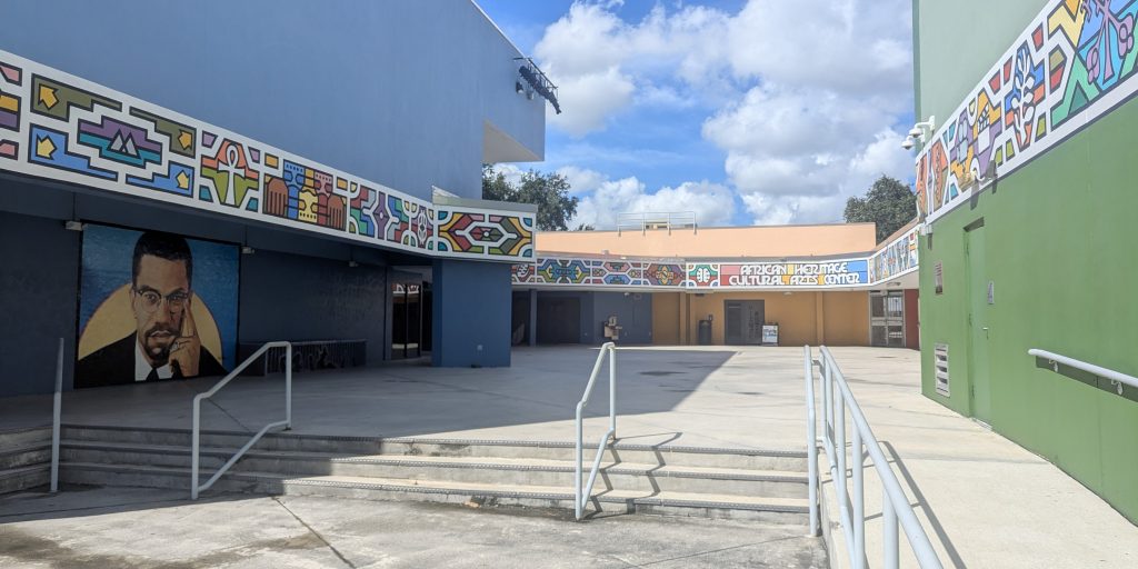Colorful courtyard with the name of the building African Heritage Cultural Arts Center.
