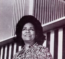 Picture of Gwendolyn Sawyer Cherry looking up with buildings in the backgroun