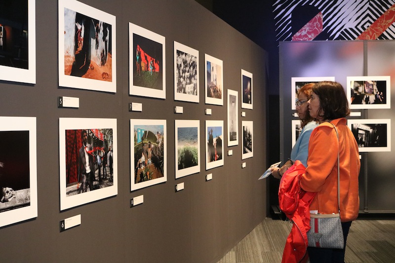 women looking at photographs