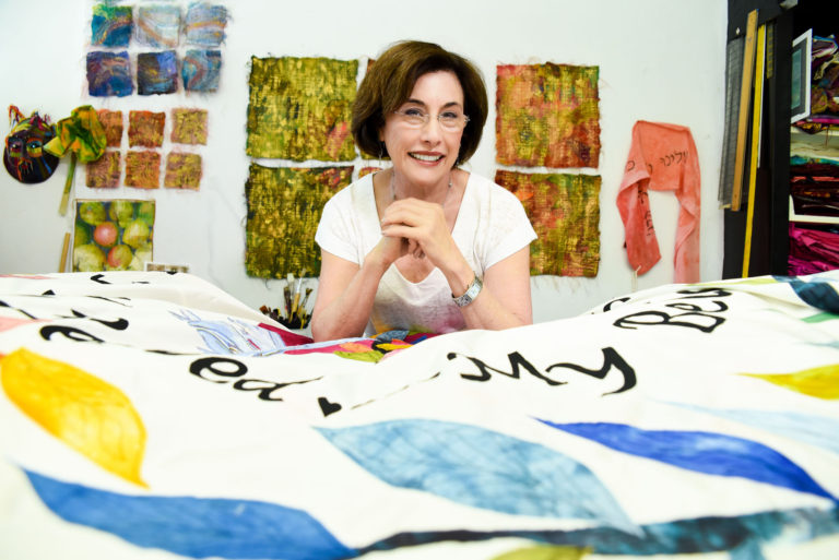 woman with tapestry