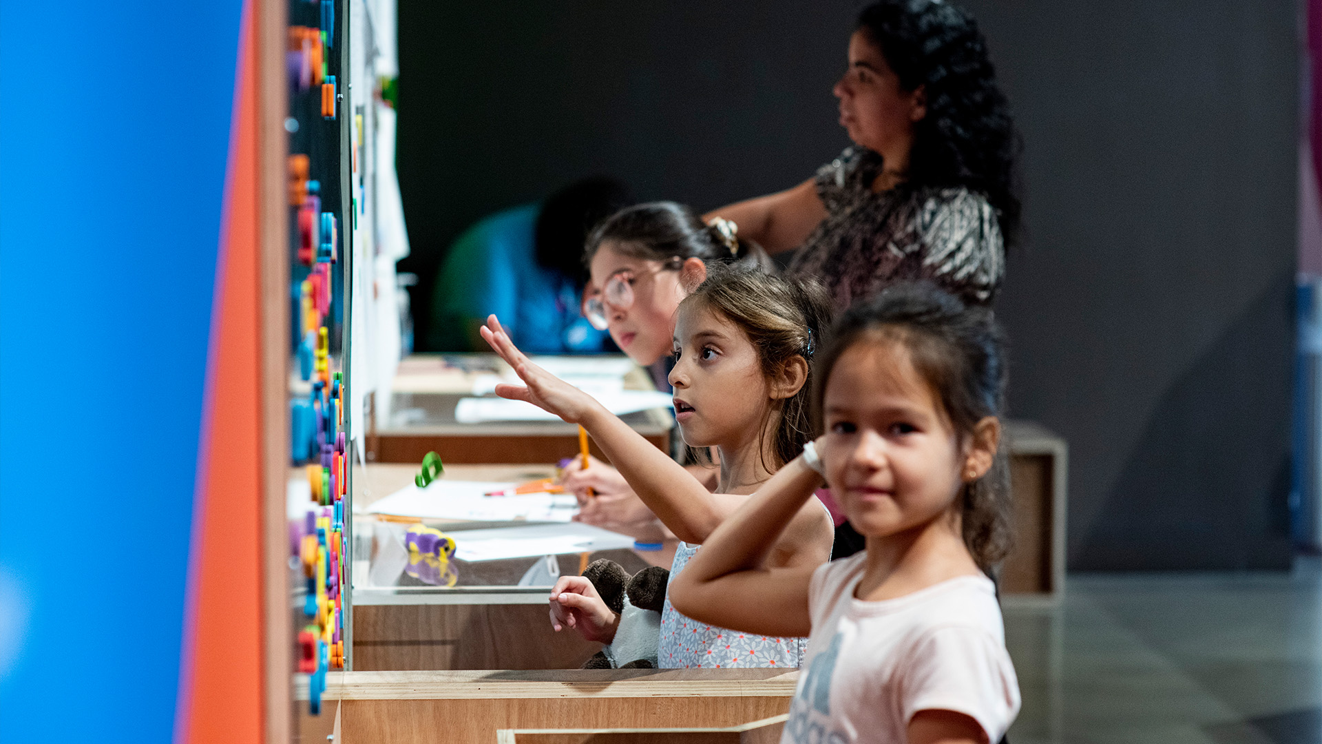 Children playing in museum gallery.