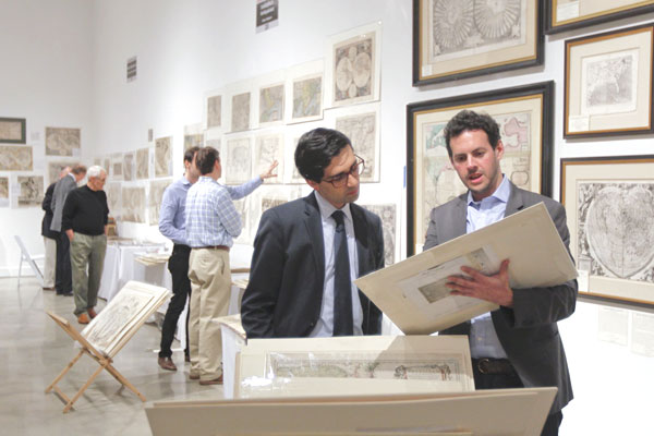 man looking at historical photo