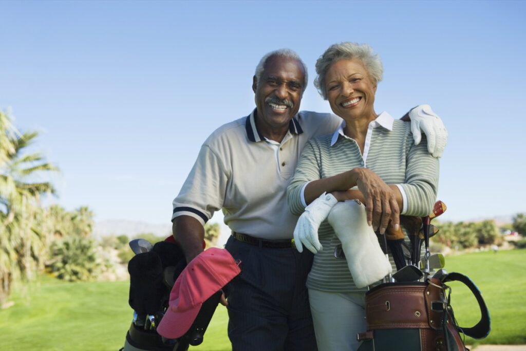two older adults on a golf course